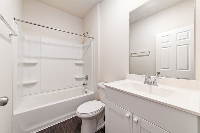 full bathroom with bathtub / shower combination, vanity, hardwood / wood-style flooring, and toilet