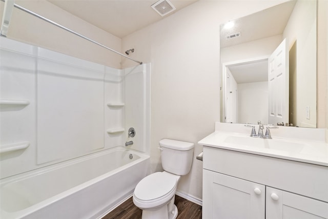 full bathroom with vanity, toilet, wood-type flooring, and tub / shower combination