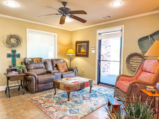 tiled living room with ceiling fan and crown molding