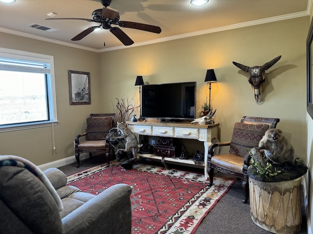 living room with carpet floors, ceiling fan, and ornamental molding