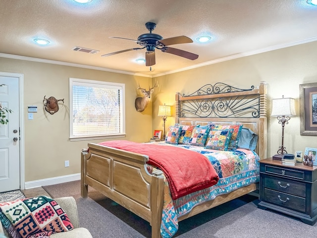 bedroom featuring ceiling fan, crown molding, carpet floors, and a textured ceiling