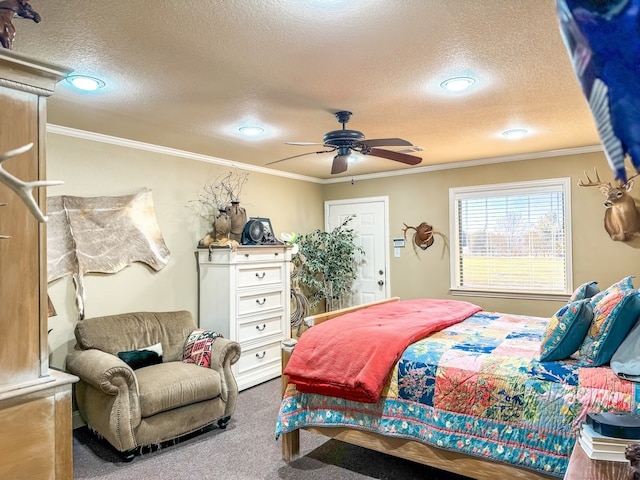 bedroom with a textured ceiling, carpet floors, and ceiling fan