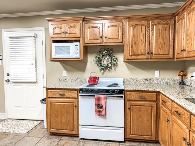 kitchen featuring light stone counters, white appliances, ornamental molding, and light tile patterned floors