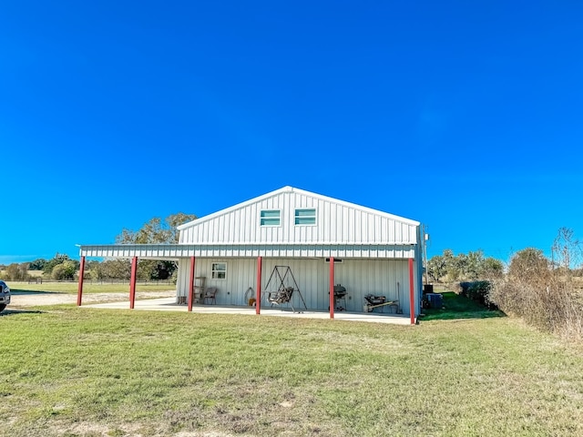 view of outbuilding featuring a yard