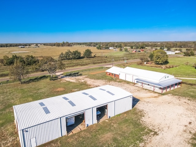 birds eye view of property featuring a rural view