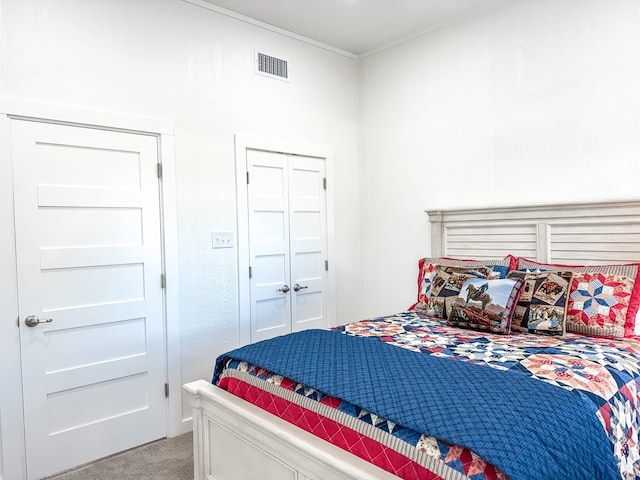 bedroom with a closet and light colored carpet