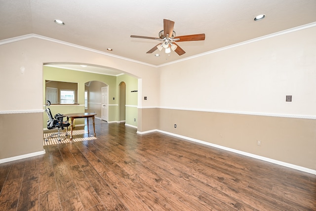 unfurnished room with ceiling fan, dark hardwood / wood-style flooring, ornamental molding, and vaulted ceiling