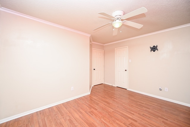 unfurnished room featuring a textured ceiling, light hardwood / wood-style floors, ceiling fan, and ornamental molding