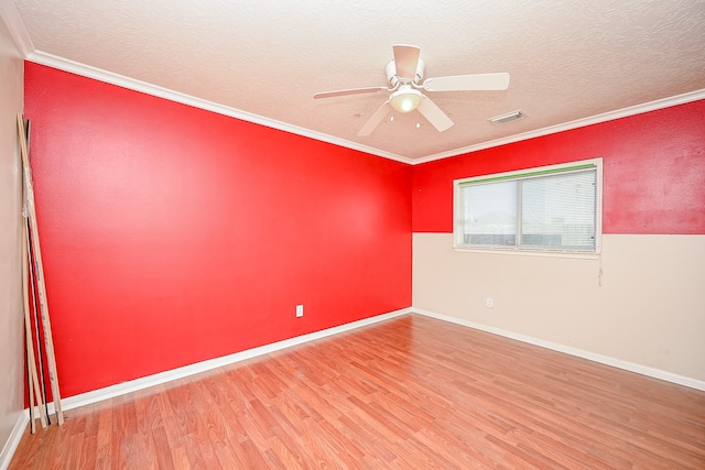 empty room with crown molding, ceiling fan, a textured ceiling, and hardwood / wood-style flooring