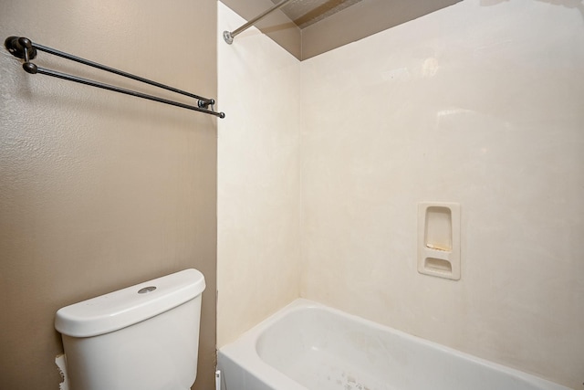 bathroom with shower / bathing tub combination and toilet