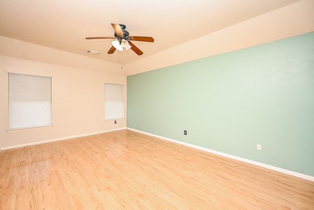 empty room featuring ceiling fan and light hardwood / wood-style floors