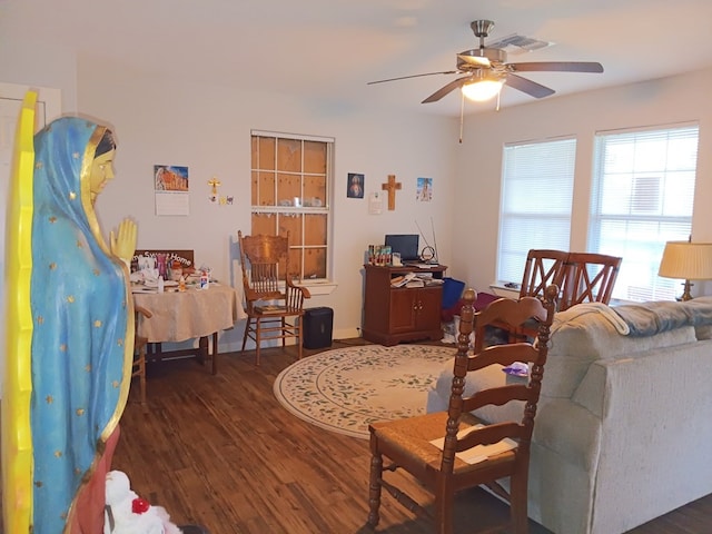 living room with ceiling fan and dark hardwood / wood-style floors