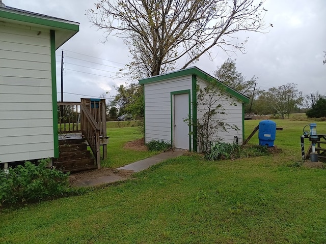 view of outdoor structure with a lawn