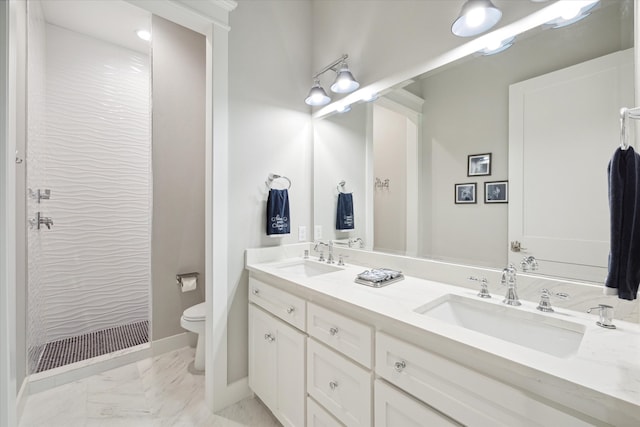 bathroom featuring vanity, toilet, and walk in shower