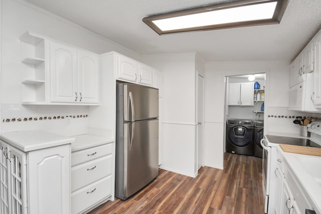 kitchen with white appliances, a textured ceiling, dark wood-type flooring, white cabinets, and independent washer and dryer