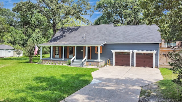 view of front of home with a front lawn, a porch, and a garage