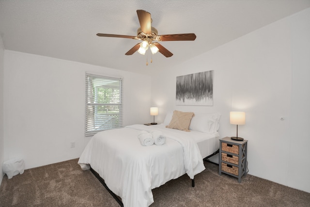 carpeted bedroom featuring vaulted ceiling and ceiling fan