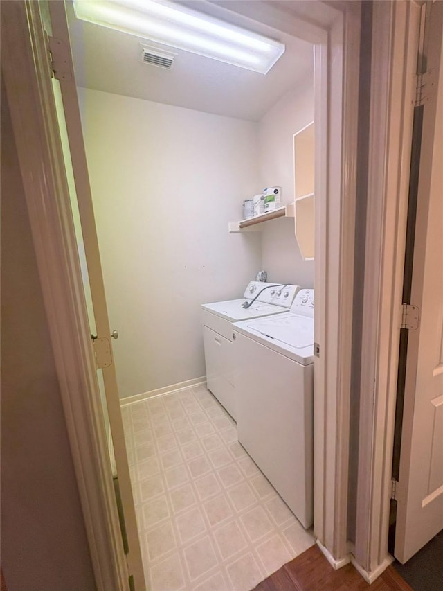 laundry area featuring separate washer and dryer