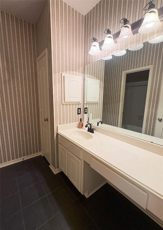 bathroom featuring tile patterned flooring and vanity