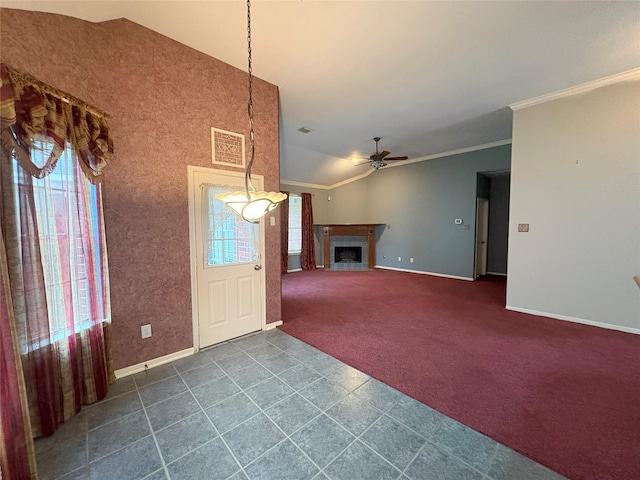 entrance foyer with vaulted ceiling, ceiling fan, and crown molding