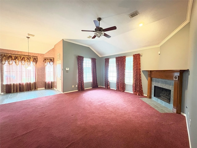 unfurnished living room featuring ceiling fan with notable chandelier, light colored carpet, lofted ceiling, and a fireplace