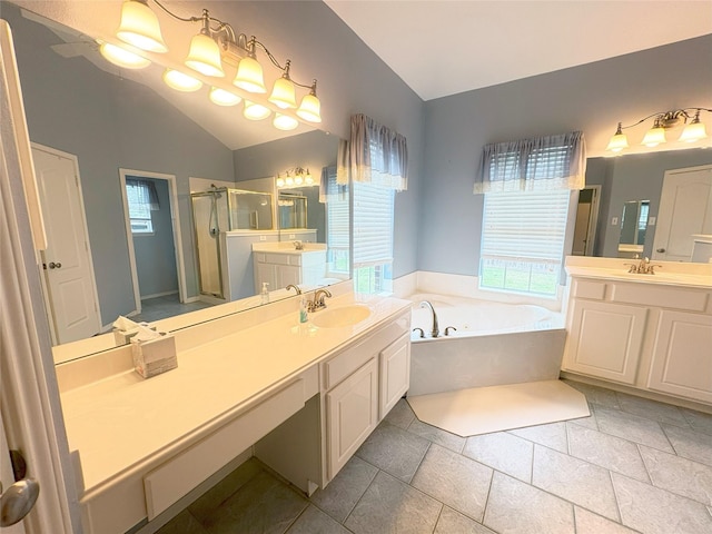 bathroom with tile patterned floors, vanity, and separate shower and tub