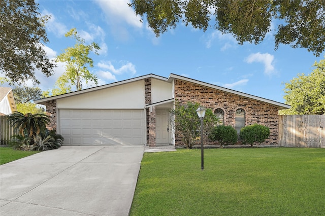 ranch-style home with a front yard and a garage