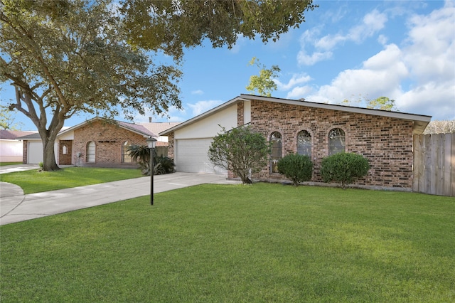 ranch-style home with a front yard and a garage