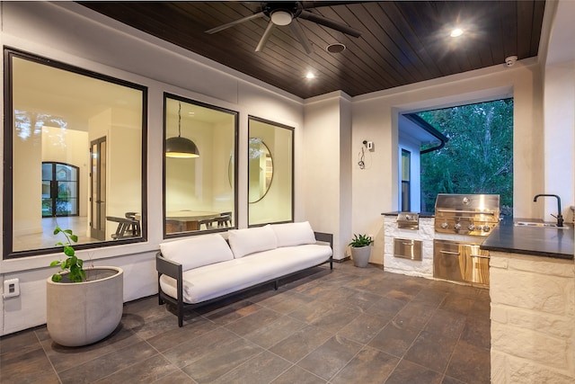 view of patio / terrace with an outdoor hangout area, area for grilling, ceiling fan, sink, and grilling area