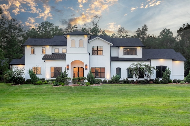 view of front of property with a yard