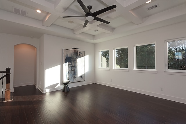 unfurnished room with a healthy amount of sunlight, dark hardwood / wood-style flooring, and coffered ceiling