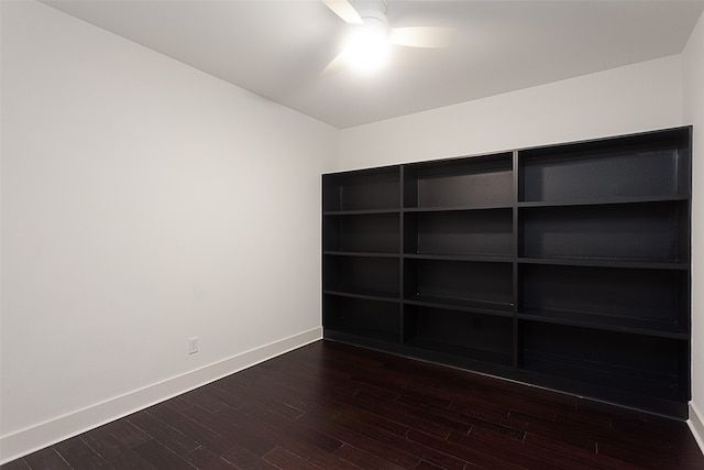 unfurnished bedroom featuring ceiling fan and dark hardwood / wood-style floors