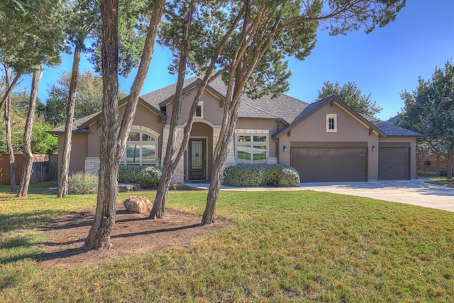 915 Wilderness Oaks, New Braunfels, TX 78132 - view of front of property with a garage and a front lawn