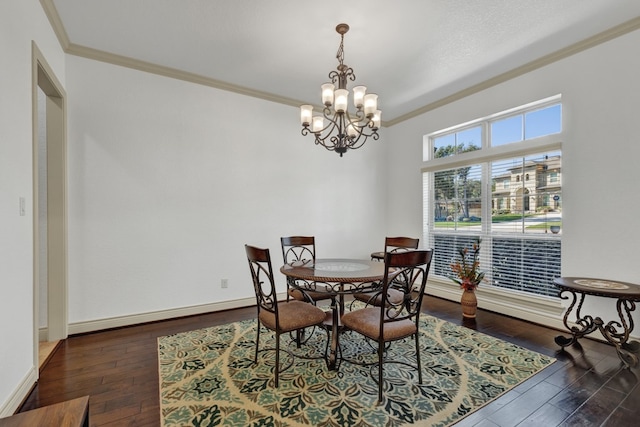 dining area with ornamental molding, dark hardwood / wood-style floors, and a notable chandelier