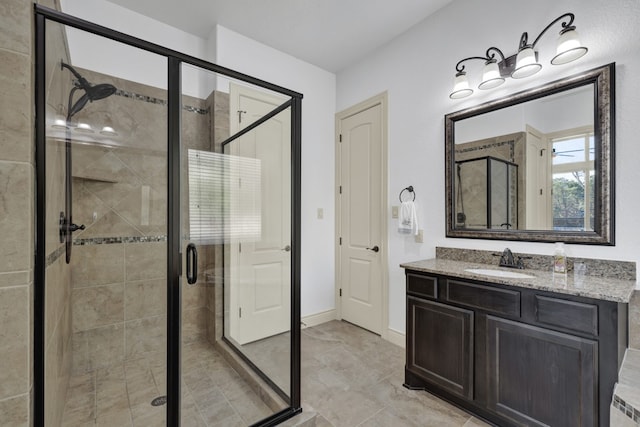 bathroom featuring vanity and an enclosed shower