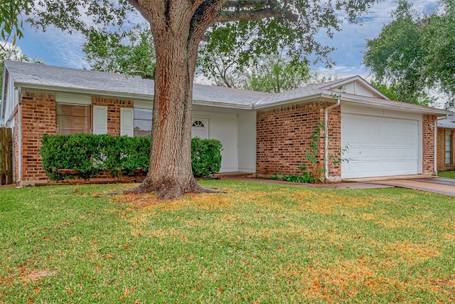 ranch-style house featuring a garage and a front lawn