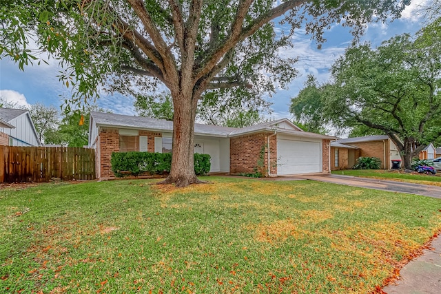 single story home featuring a front yard and a garage