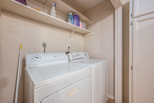 laundry area with washing machine and clothes dryer