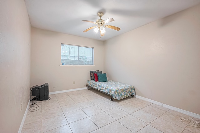 unfurnished bedroom featuring ceiling fan and light tile patterned floors