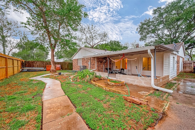 rear view of house featuring a patio and central air condition unit