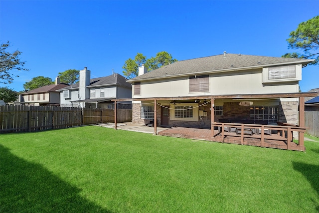 back of property featuring a lawn and a patio