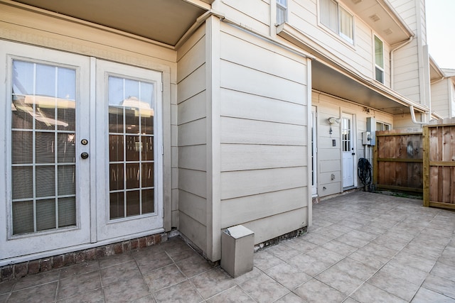 property entrance featuring french doors and a patio area