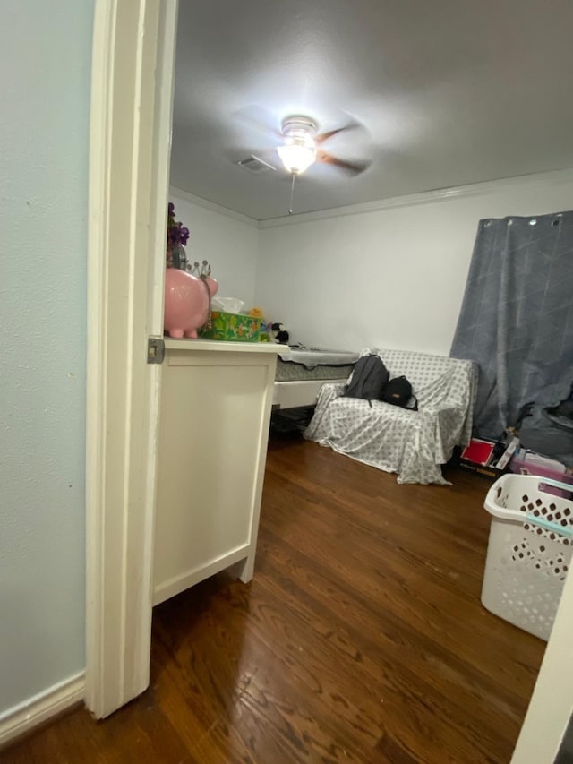 bedroom featuring ceiling fan and dark hardwood / wood-style flooring