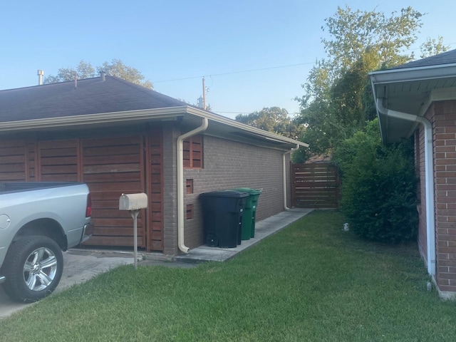 view of property exterior featuring a lawn