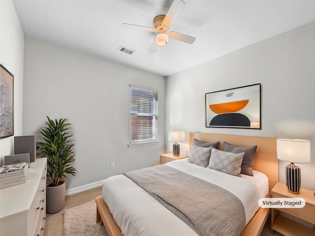 bedroom featuring ceiling fan and light colored carpet