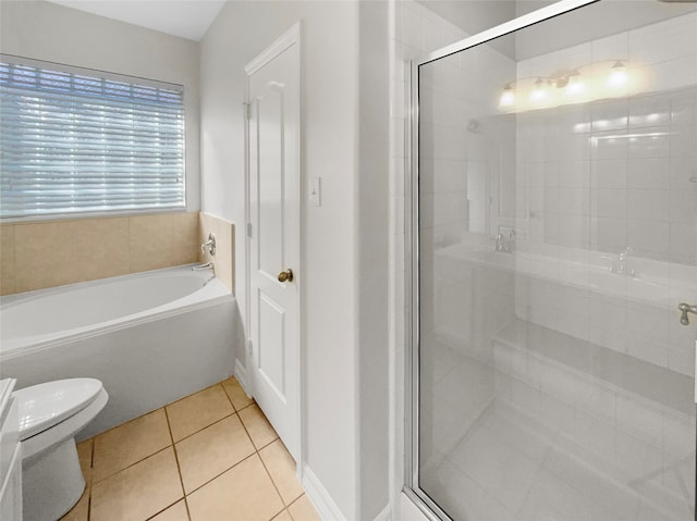 bathroom with toilet, shower with separate bathtub, and tile patterned floors