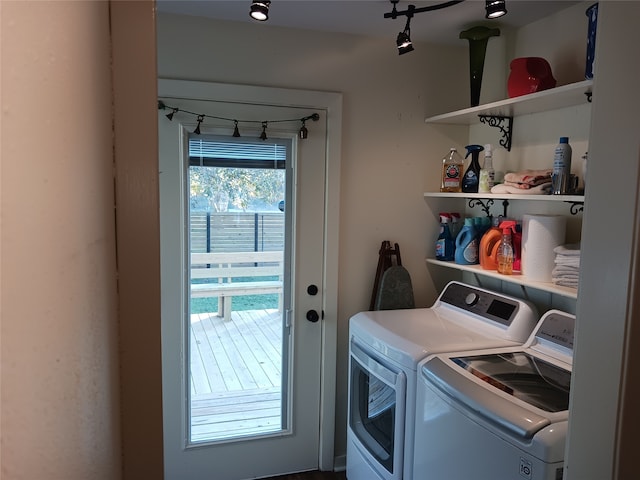 laundry room featuring washing machine and clothes dryer