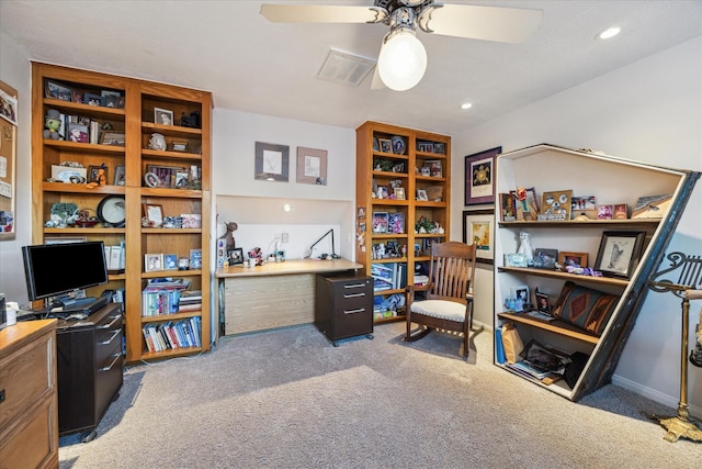 office area featuring ceiling fan and dark carpet