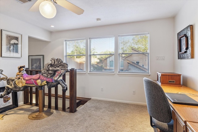 carpeted office with ceiling fan