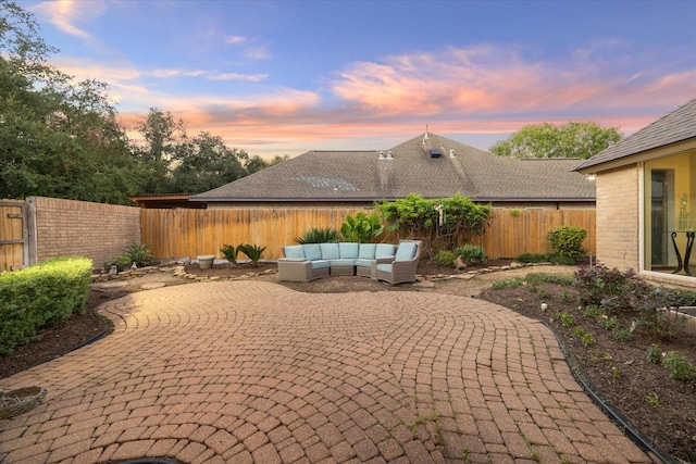 patio terrace at dusk with outdoor lounge area